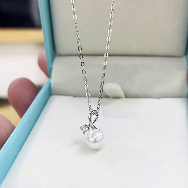 The sterling silver pearl necklace displayed in a premium jewelry box