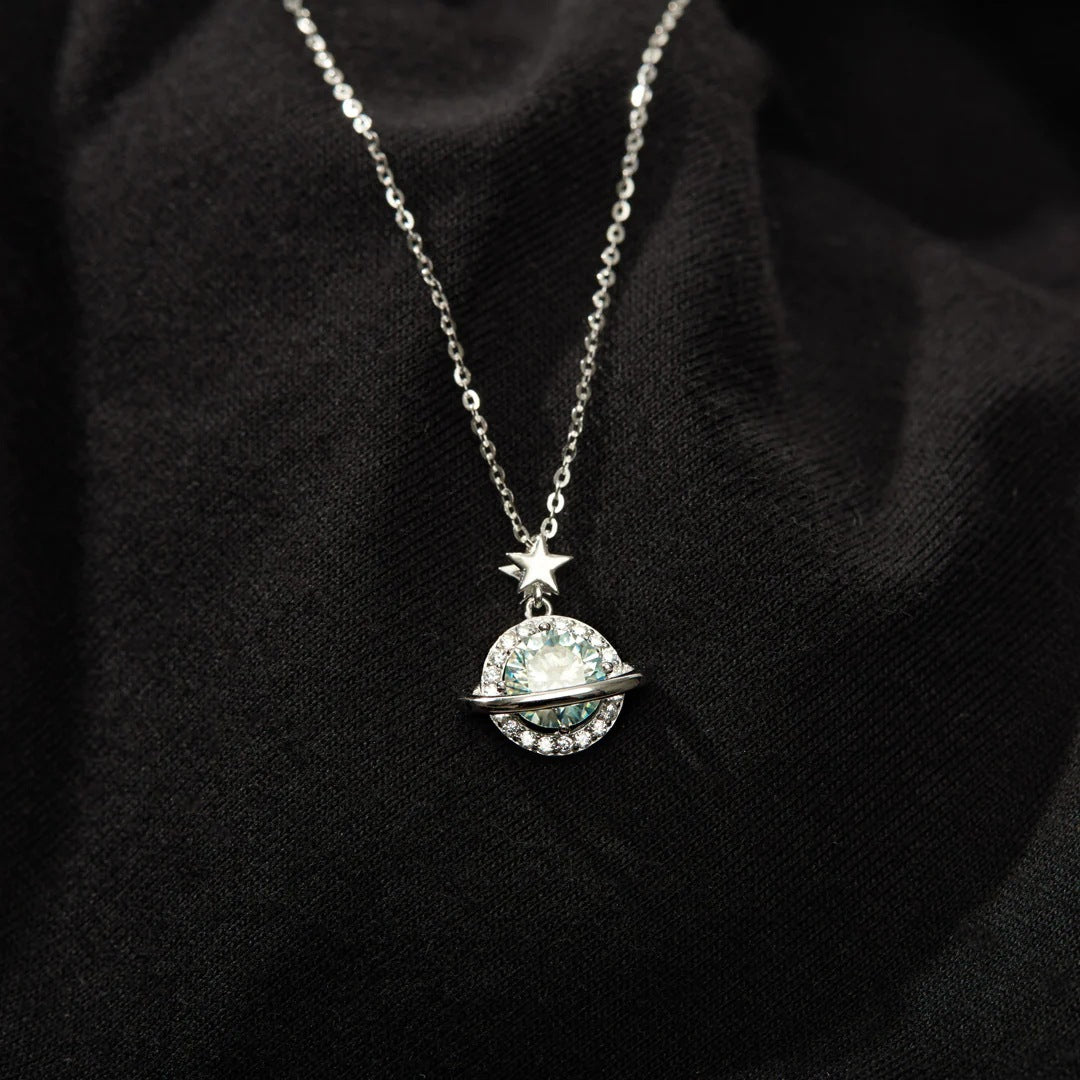 Detailed craftsmanship of the planet-inspired pendant with star charm and zircon stones.
