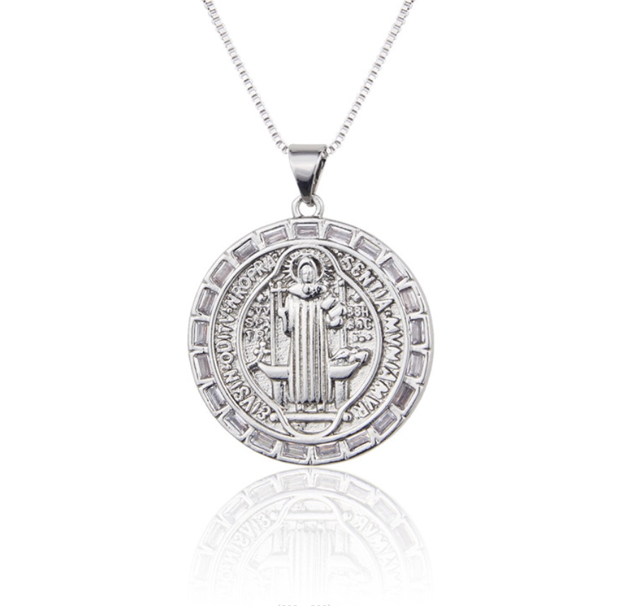 Close-up of a custom silver religious medal pendant