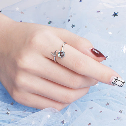 A model's hand showcasing the adjustable 925 sterling silver mermaid tail rings.