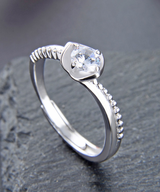 Detailed view of the 925 sterling silver promise ring with a clear gemstone