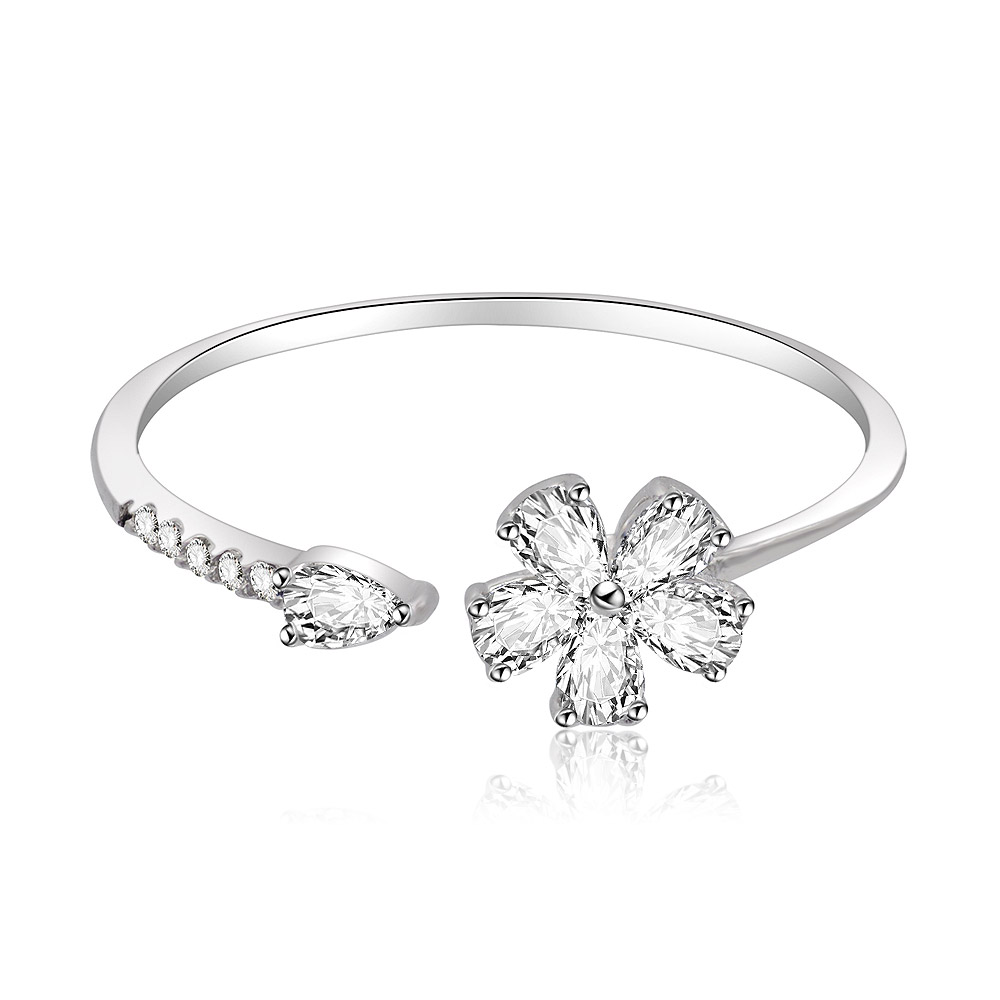 Detailed view of the Flower Petal Ring in Rhodium on a reflective surface