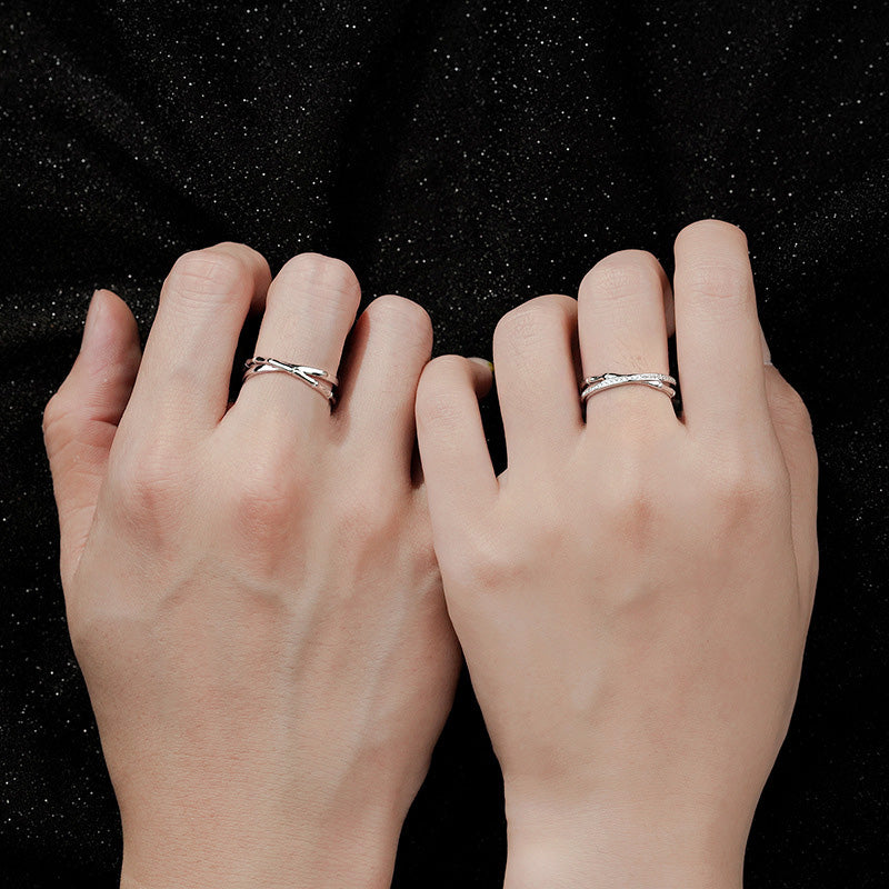 A model wearing the adjustable bamboo cross design couple rings.