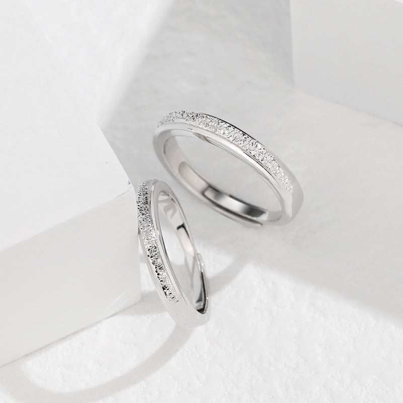 A pair of Galaxy Bling couple rings made from 925 sterling silver, displayed together.