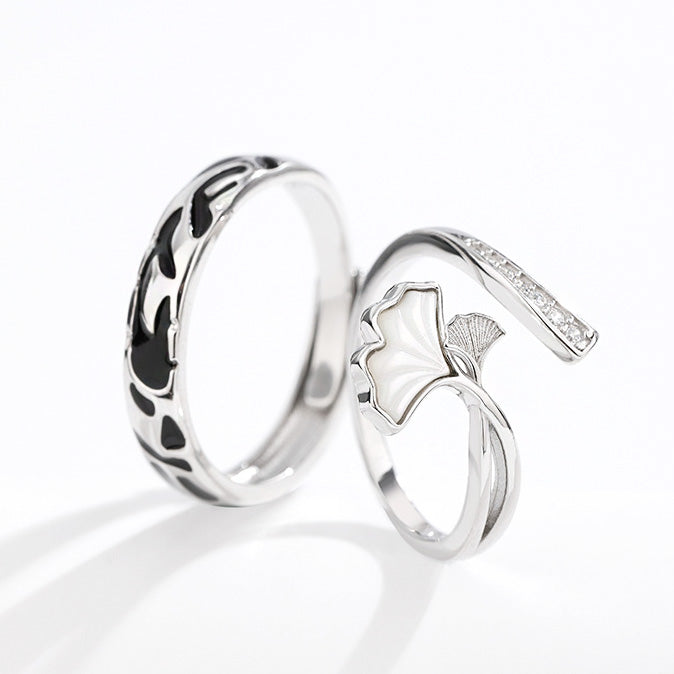 Detailed view of the ginkgo leaf pattern on the sterling silver couple rings