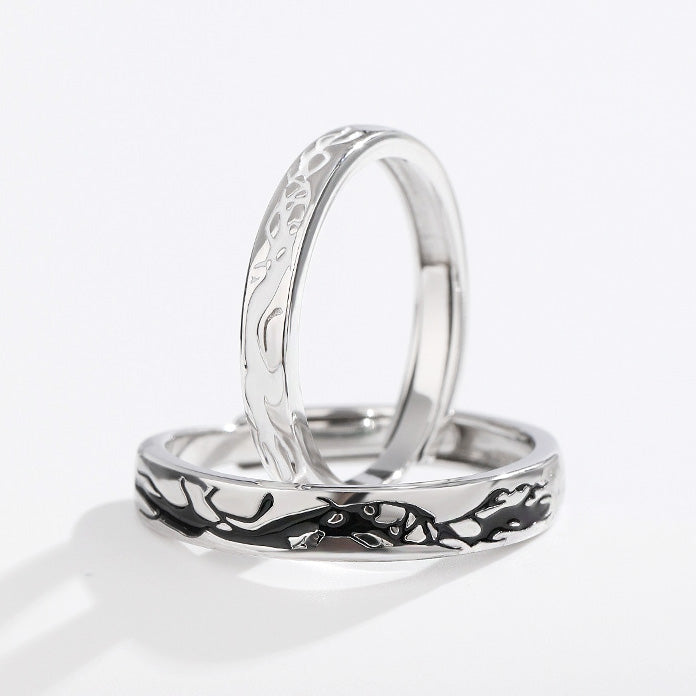 Close-up of the unique wave pattern on the matching silver couple rings