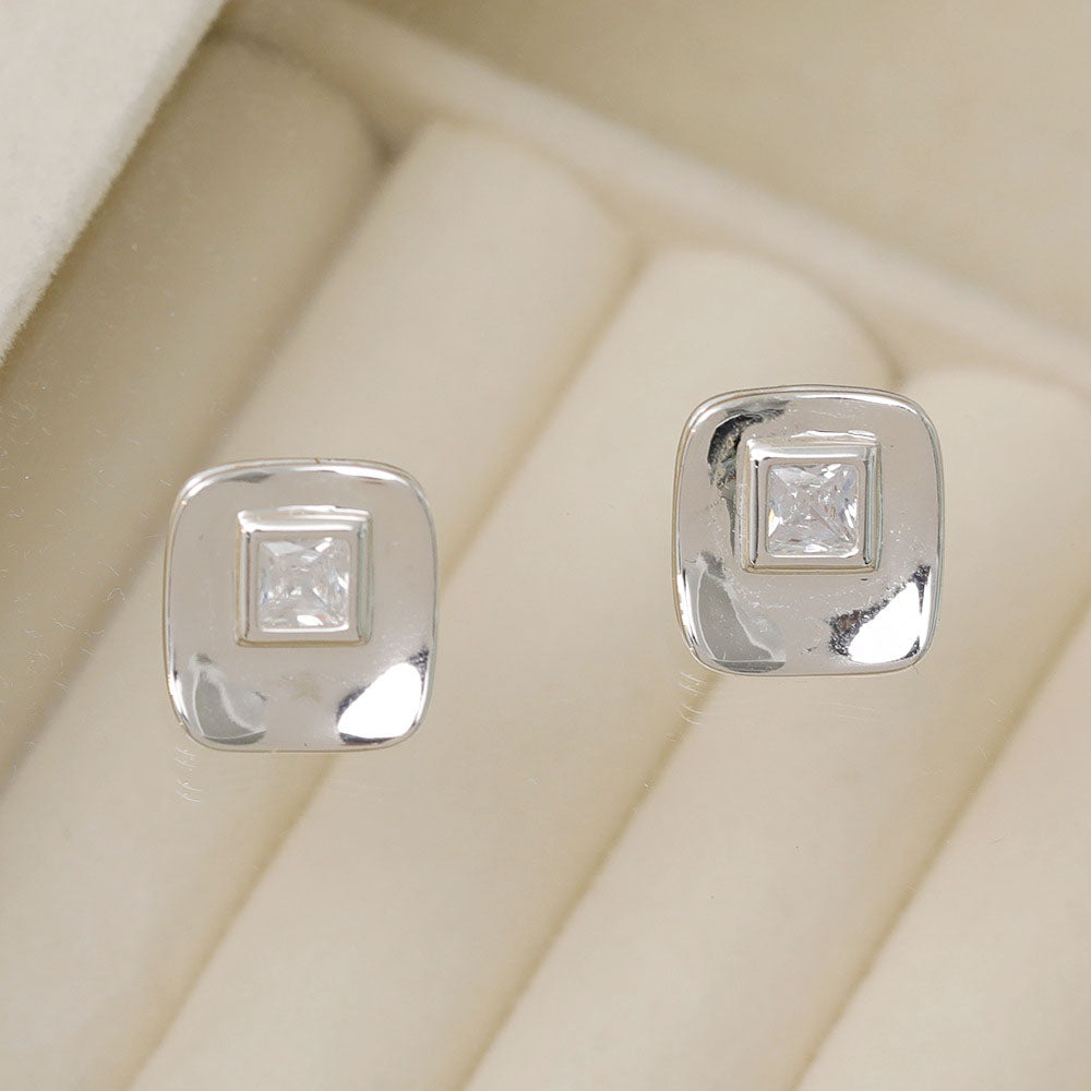 Detailed shot of the silver square stud earrings with brilliant cubic zirconia