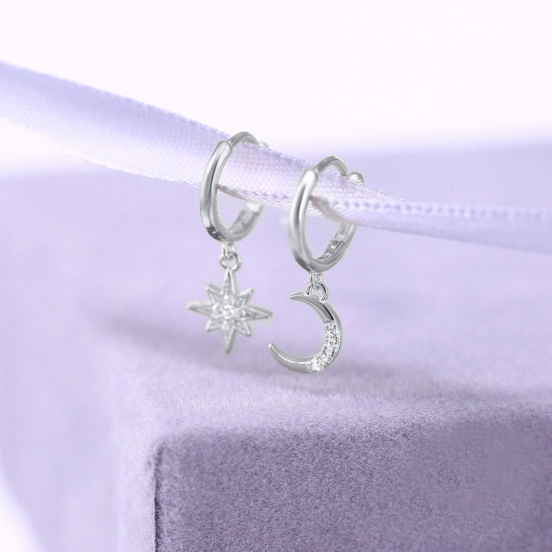 Silver version of the star and moon asymmetric hoop earrings.