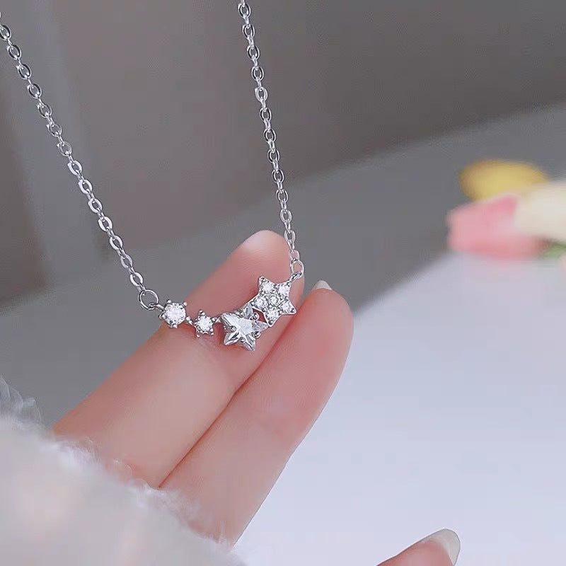 A close-up of the dainty zircon star pendant on the 925 sterling silver necklace.