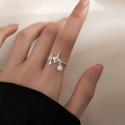 A model showcasing the sterling silver star ring set