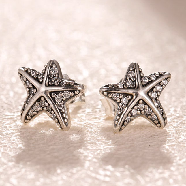 Detailed view of the 925 sterling silver starfish earrings showcasing gemstone details.