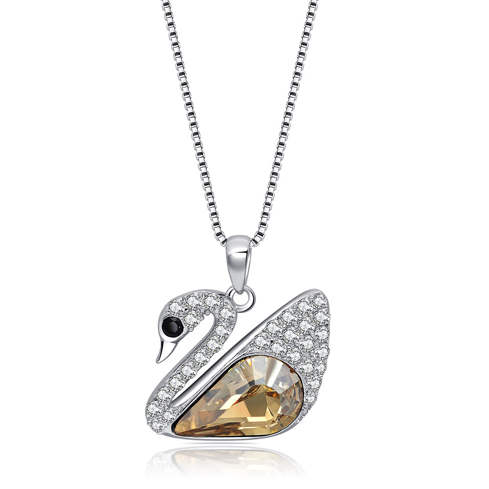 A silver swan-shaped pendant necklace with clear and golden gemstones