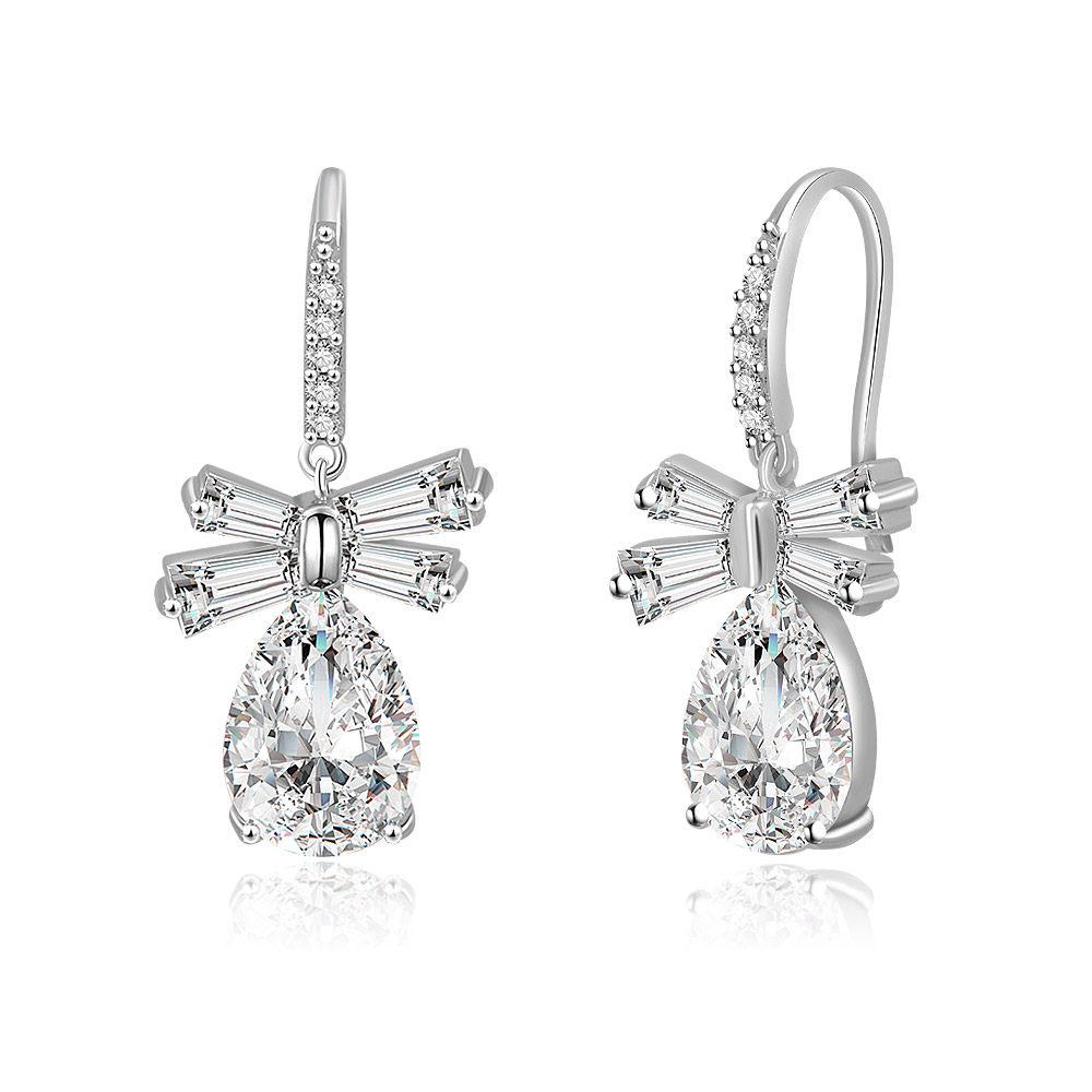 Detailed view of the bow on the White CZ Oval Drop Bow Earrings