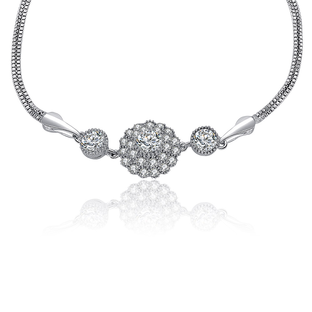 A detailed close-up of the sunburst charm on the CZ bracelet