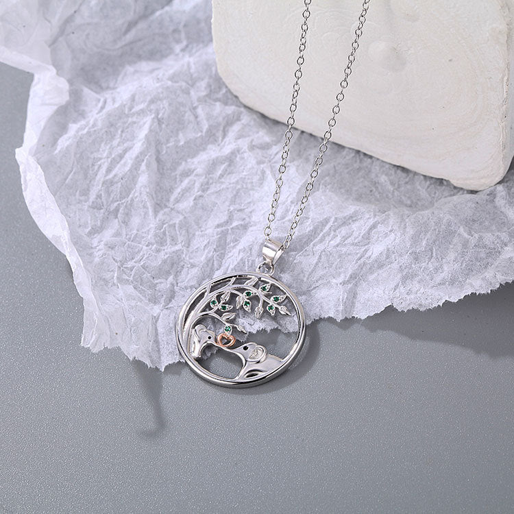 Detailed view of the sterling silver elephant pendant on the necklace.