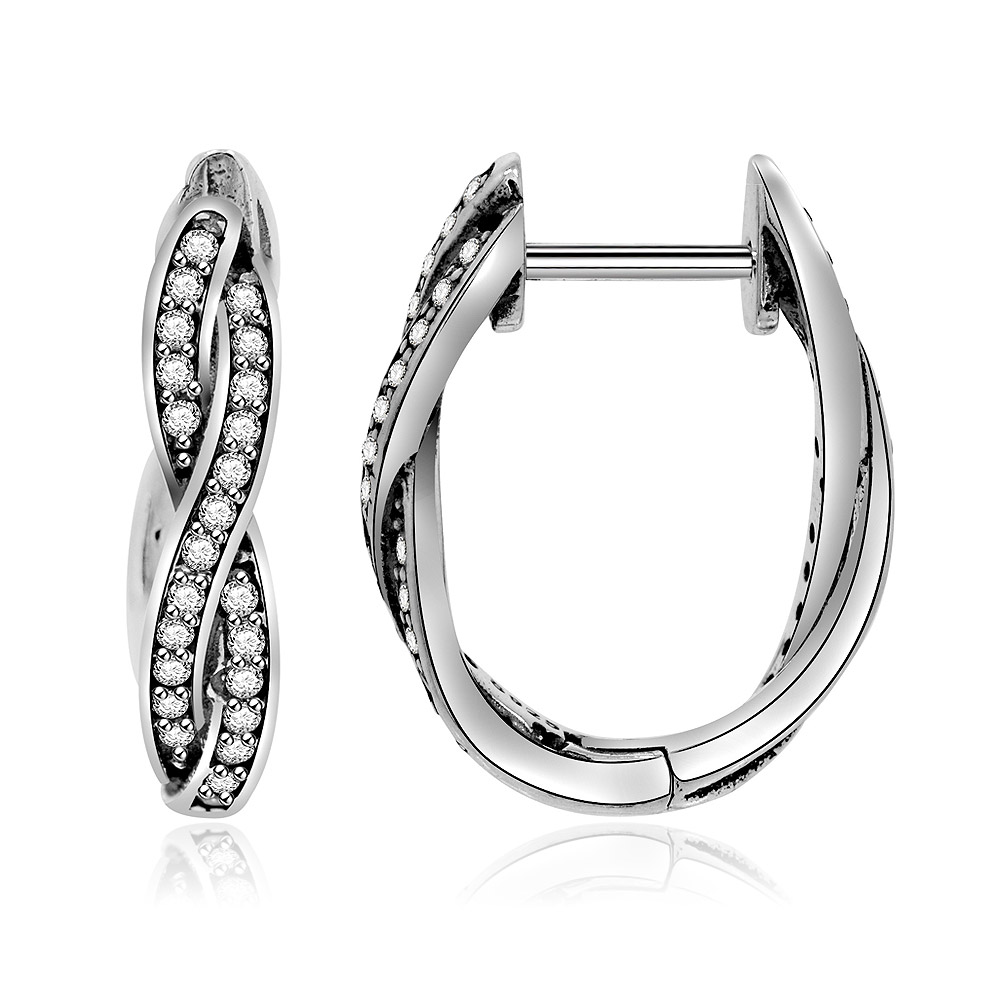 A pair of silver twist hoop huggie earrings with sparkling stones shown from the side.