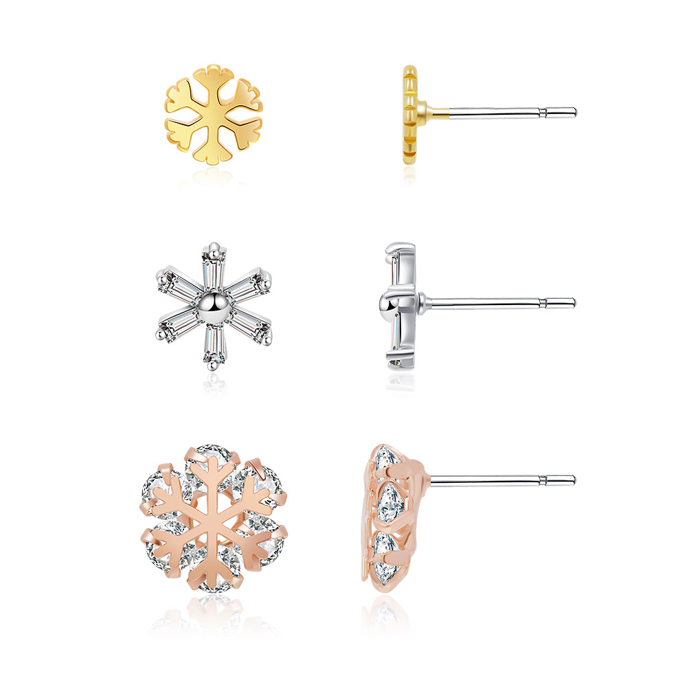 Detailed view of the three-tone snowflake earring set