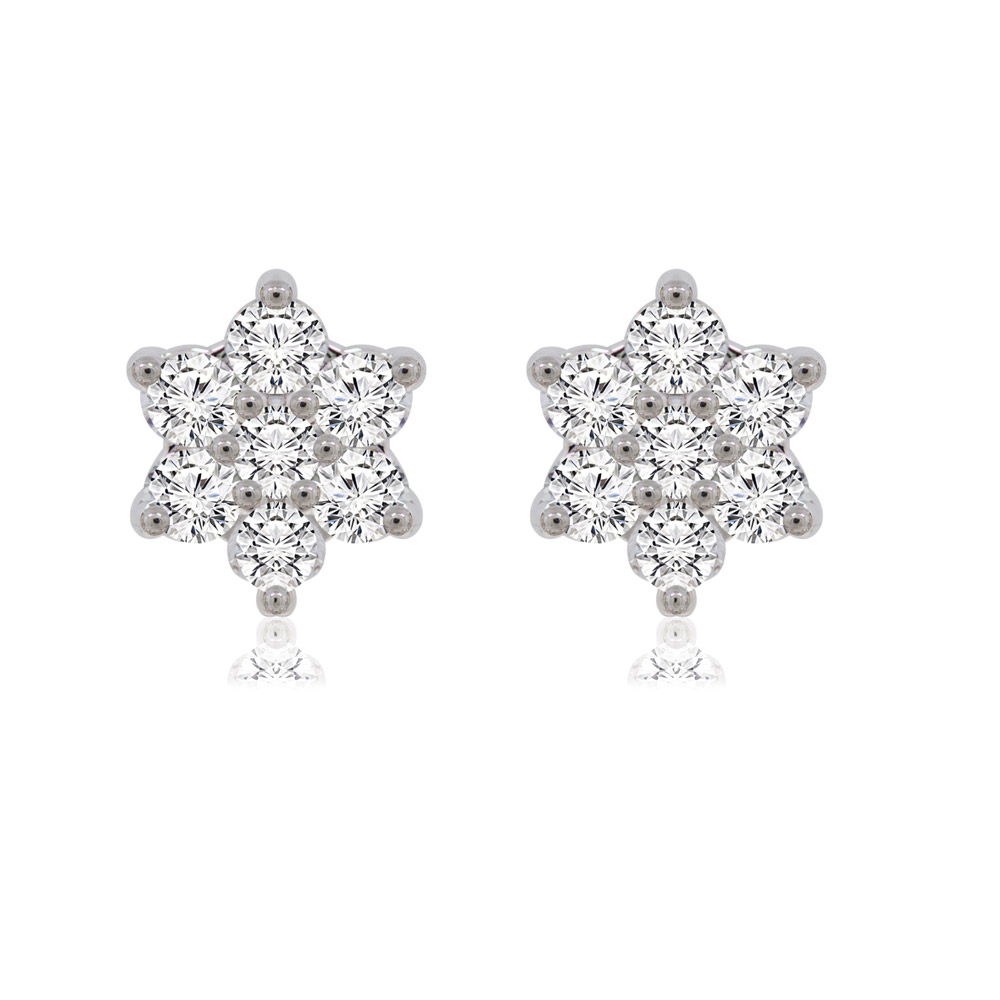 A pair of Twinkle Star Stud Earrings with cubic zirconia on a white surface
