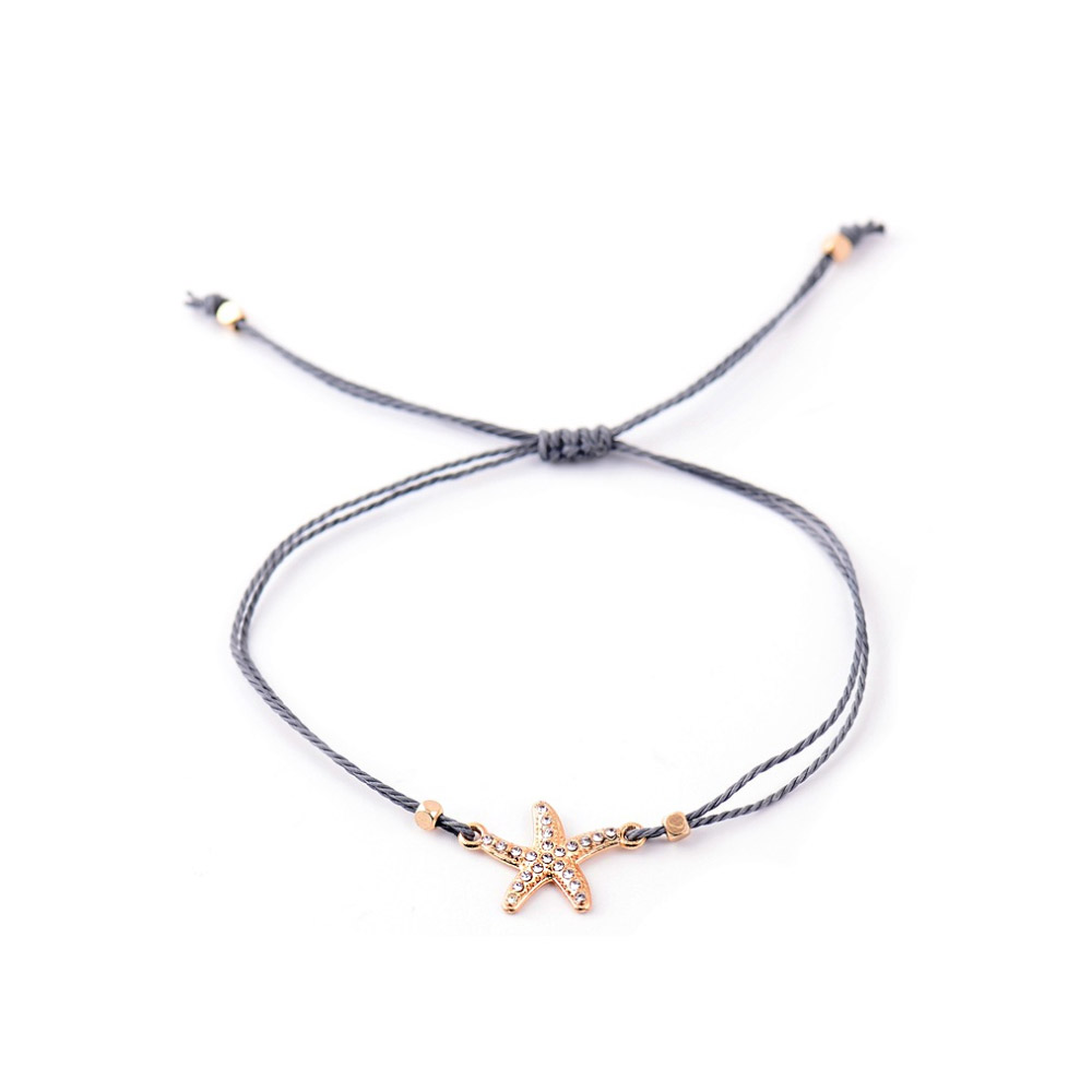 Detailed view of the starfish charm with crystal element