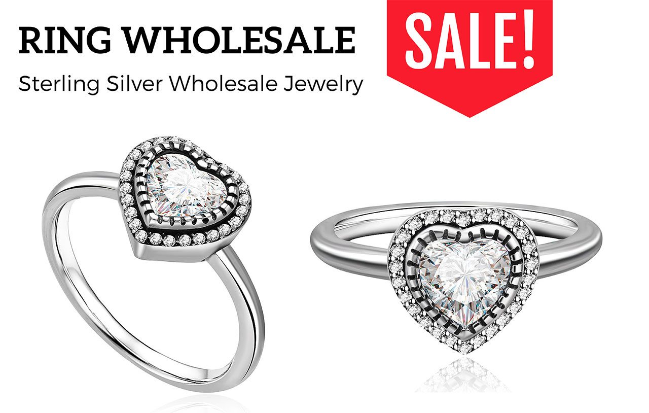 A pair of sterling silver heart-shaped rings displayed to showcase their quality and shine.