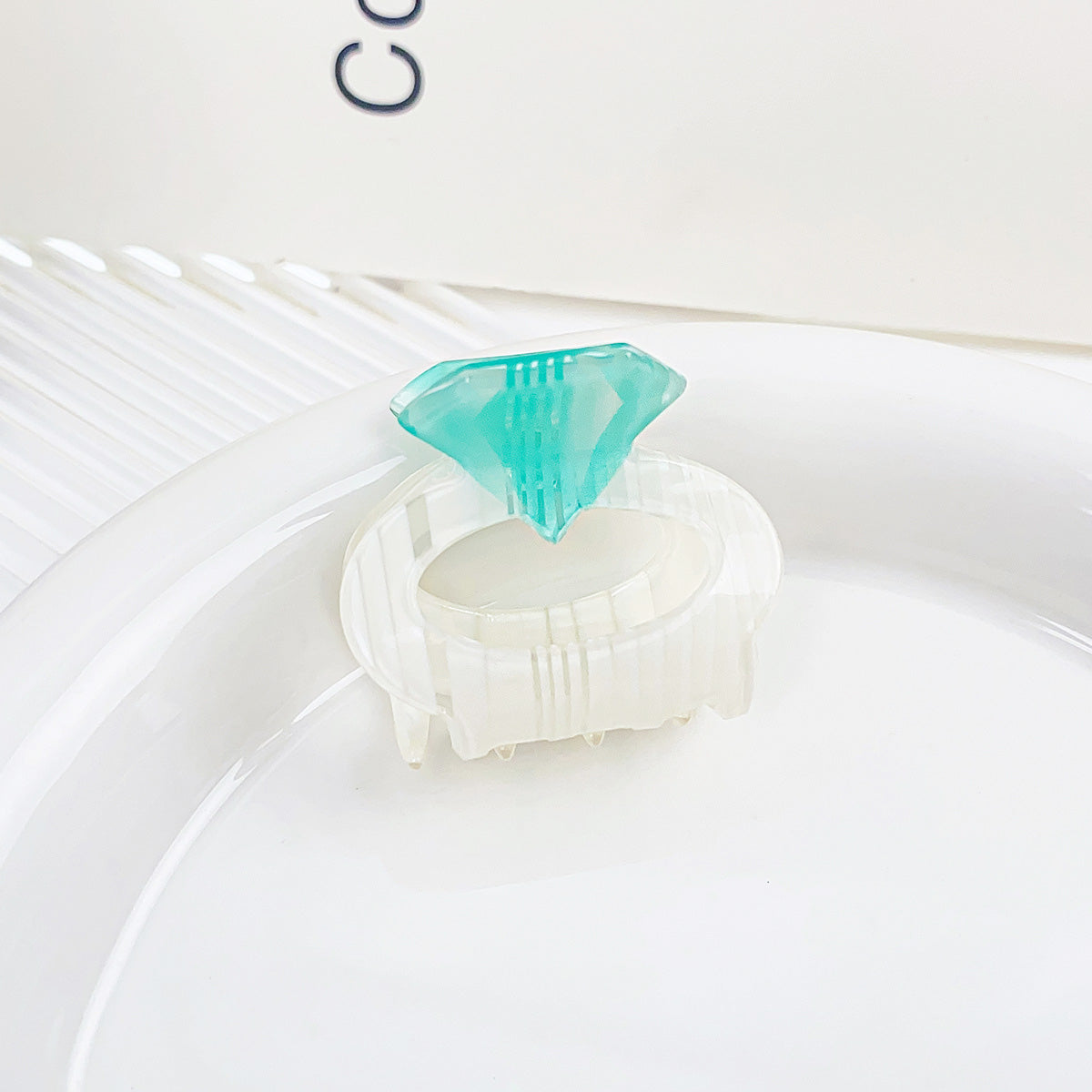 Close-up of the acrylic diamond ring hair clip