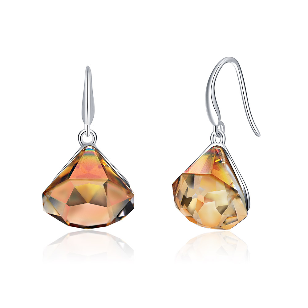 A pair of teardrop earrings with vibrant orange-toned gemstones