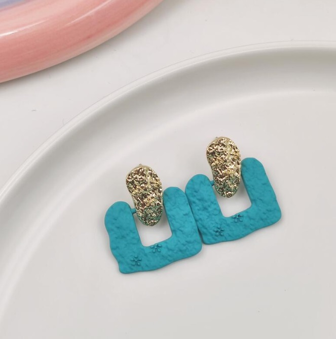 A pair of U-shaped turquoise enamel earrings with gold details