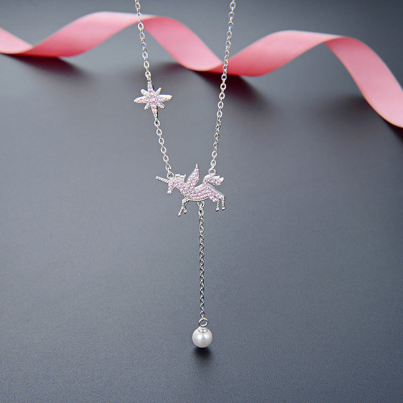 Detailed view of the 925 sterling silver unicorn necklace with pink zirconia and pearl.
