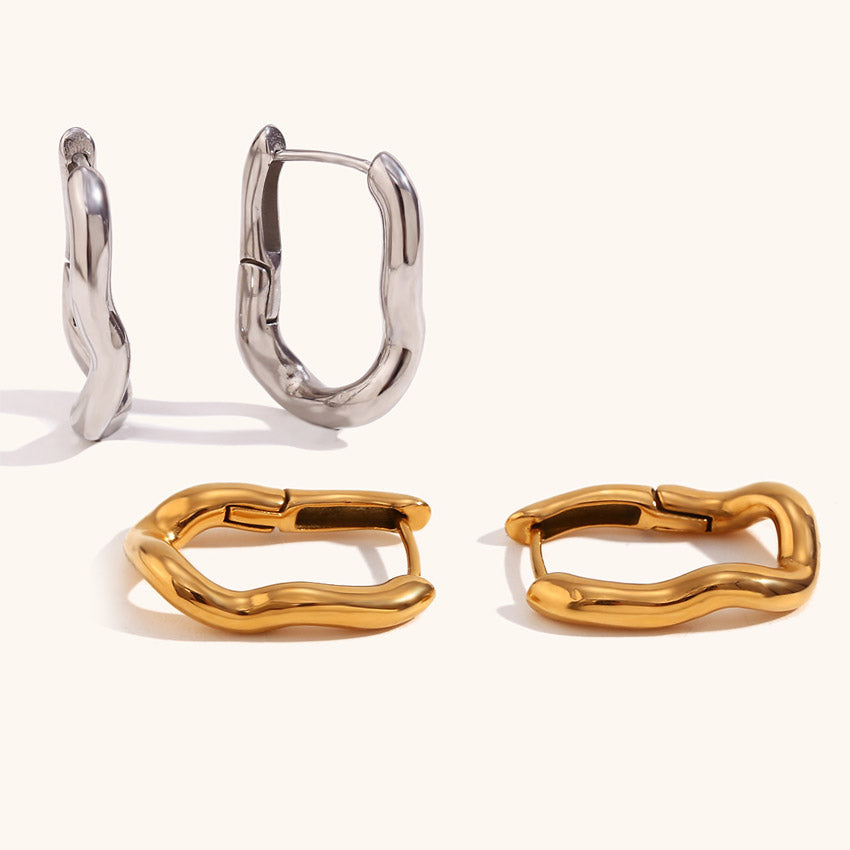 A pair of gold and silver plated rectangular huggie hoop earrings