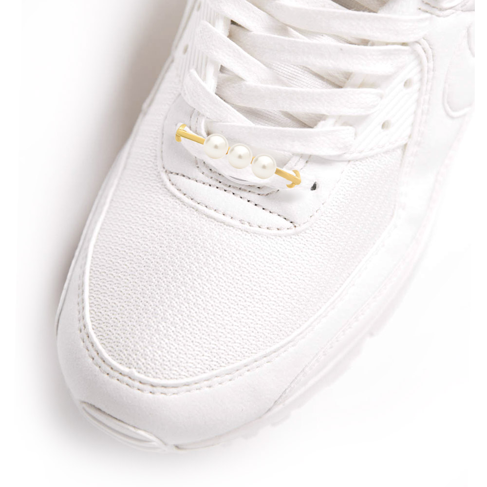 Triple pearl shoe tag shown on a white sneaker for style inspiration