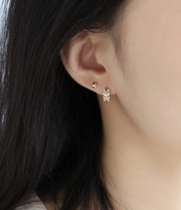Model showcasing the elegant 925 Sterling Silver Star Leafy Earrings