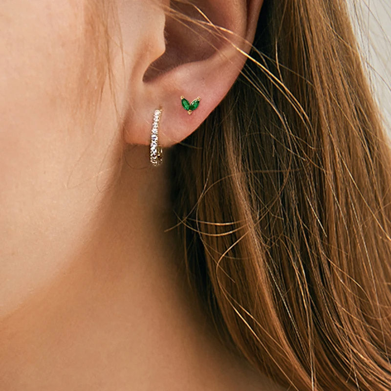 Model showcasing the elegant fit of the 925 sterling silver rectangle huggie hoop earring.