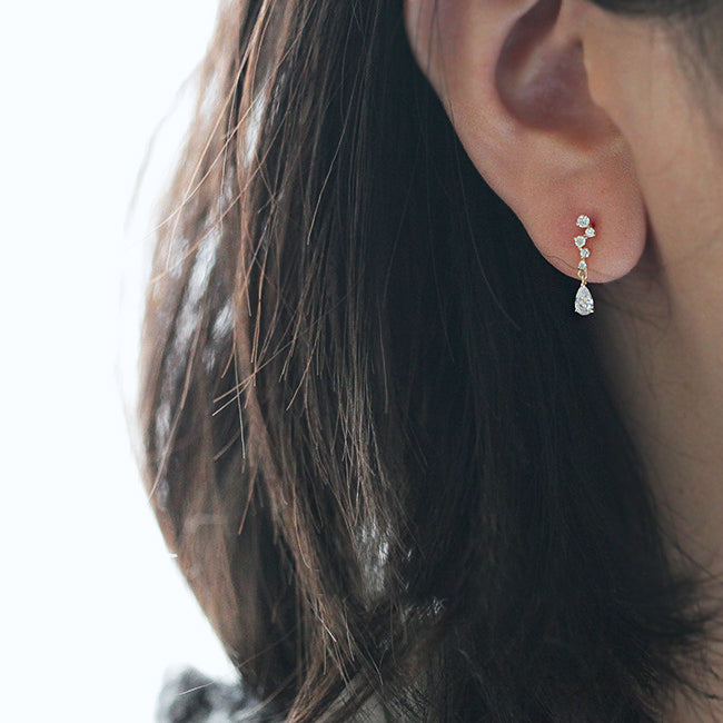 A model wearing the sparkling 925 silver crystal drop earrings to showcase their look and feel.