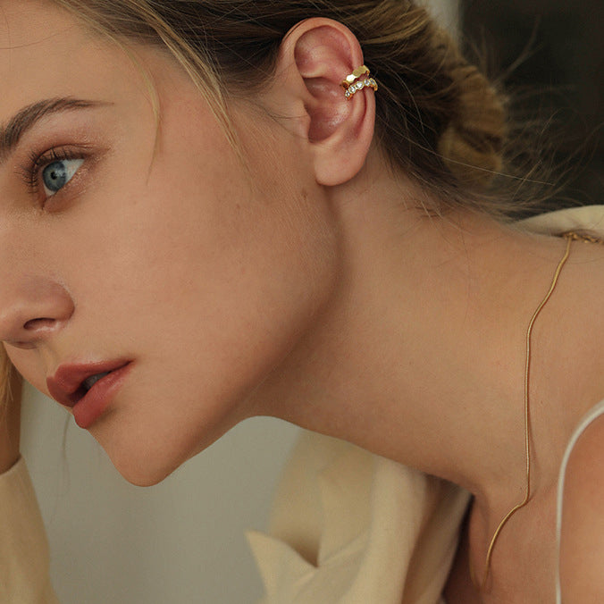 Model wearing the gold-plated 925 silver ear cuffs to show versatile styling options.