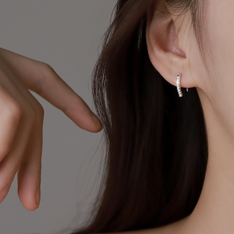 Model wearing the 925 Sterling Silver CZ Hook Earrings