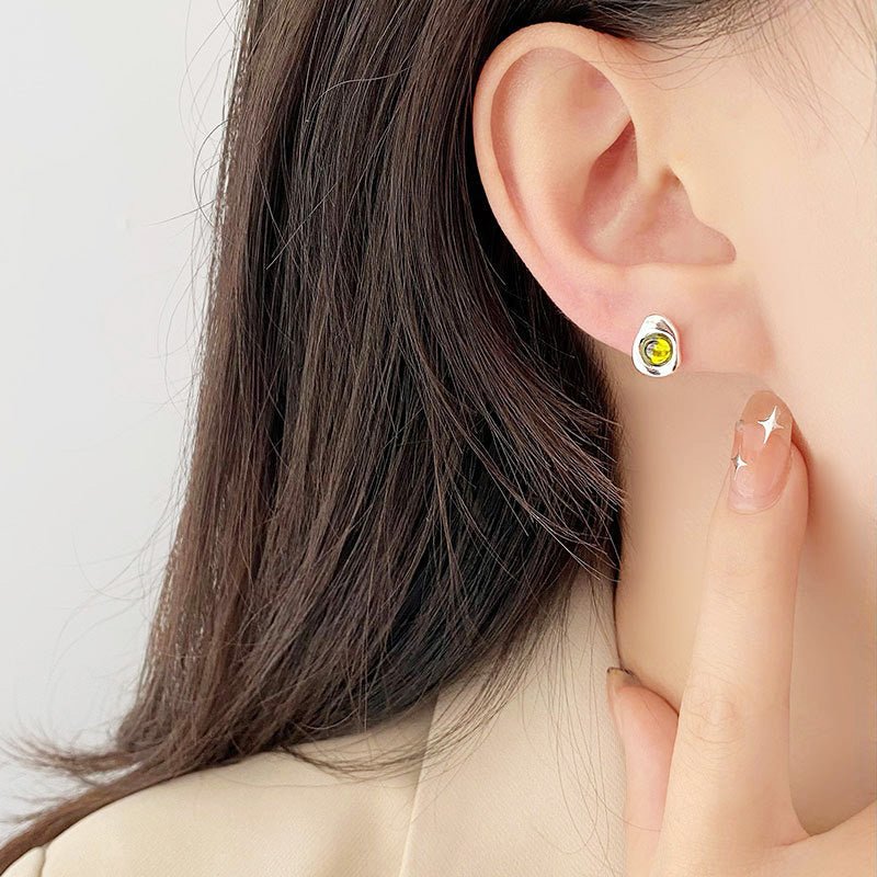 Model wearing the irregular shape opal stud earring