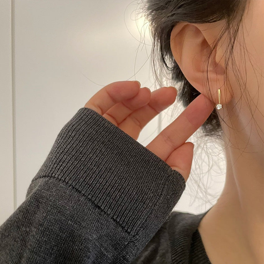 Model wearing the 14K gold plated hook earring