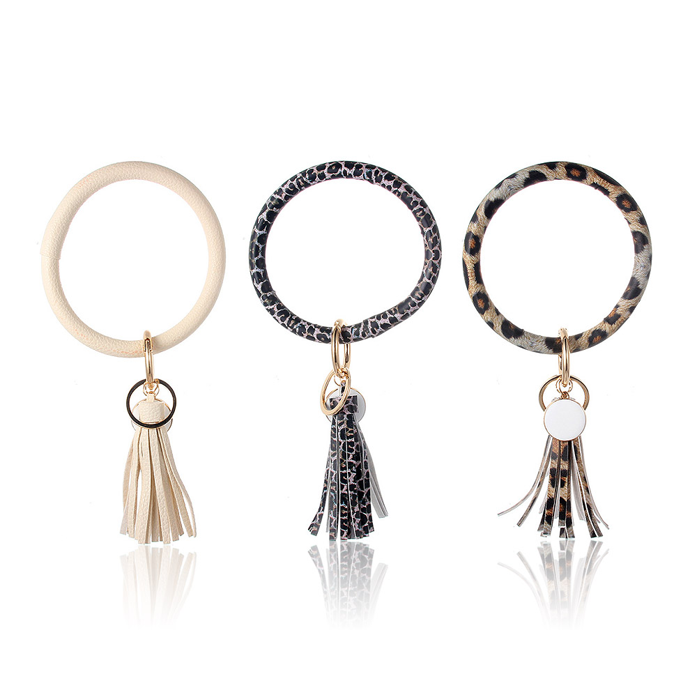 A variety of stylish PU leather wristlet keychains in different colors and patterns.