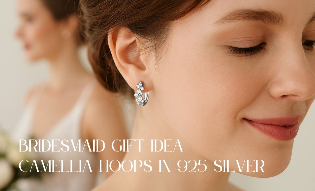 bridesmaid wearing sterling silver camellia hoop earrings a perfect gift idea for wedding day jewelry