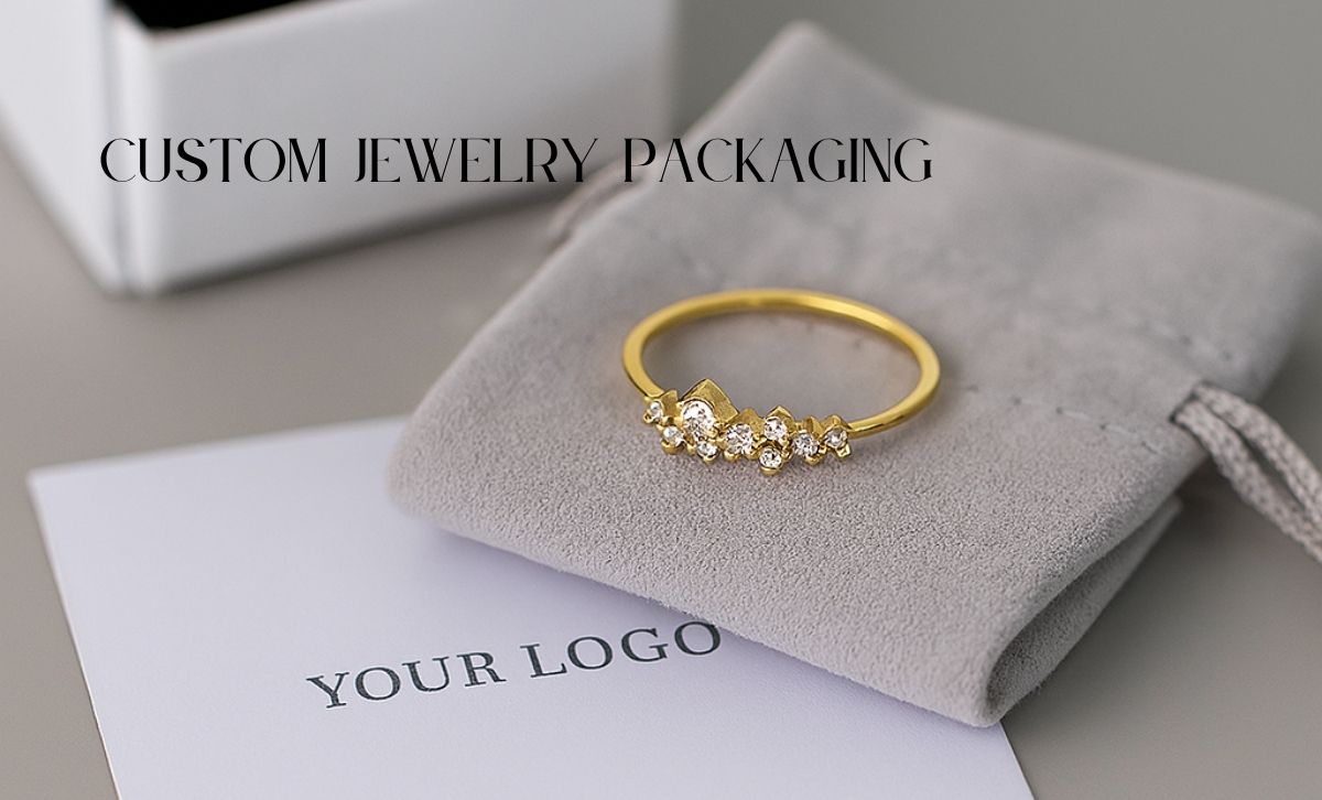 gold-925-silver-ring-with-cubic-zirconia-on-gray-pouch-example-of-custom-jewelry-packaging-with-logo-for-gift-brands