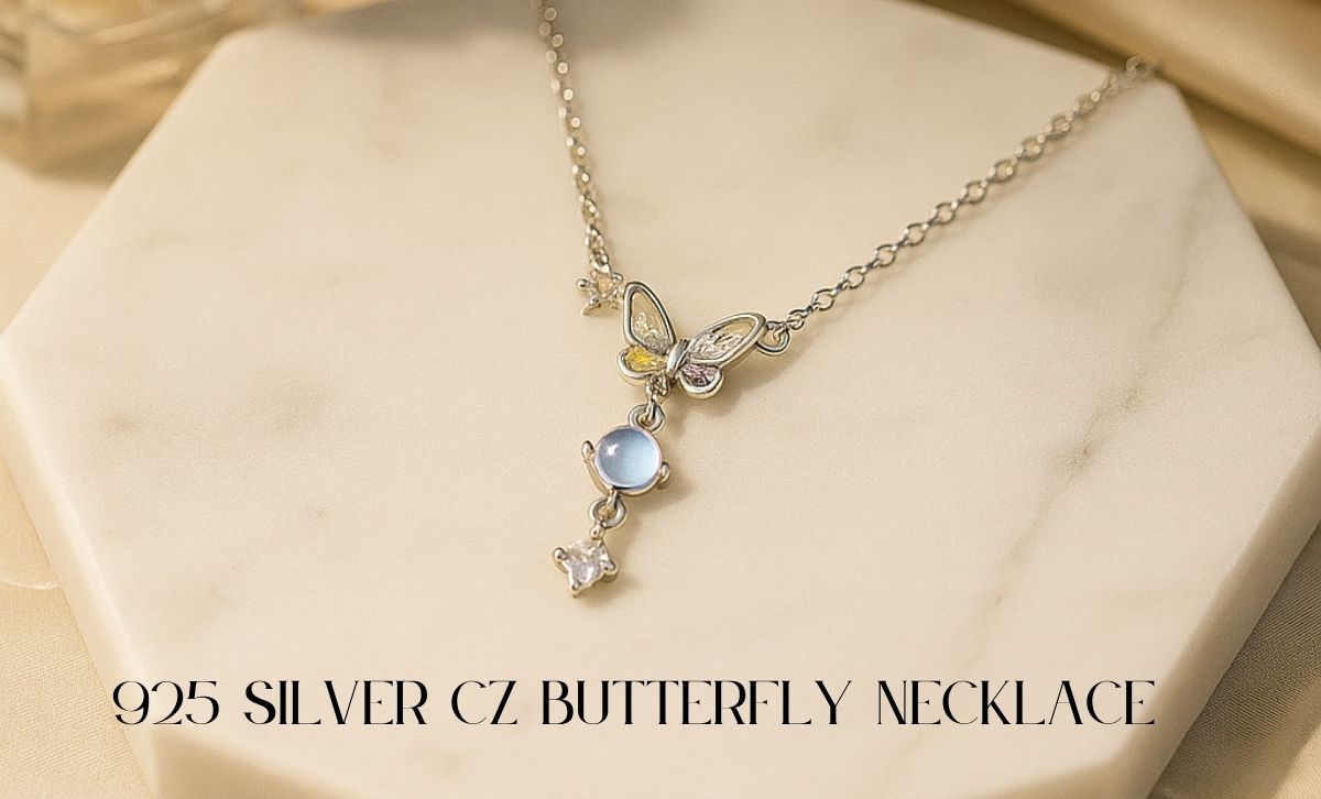 925 silver CZ butterfly necklace for graduation gift – close-up view on marble surface