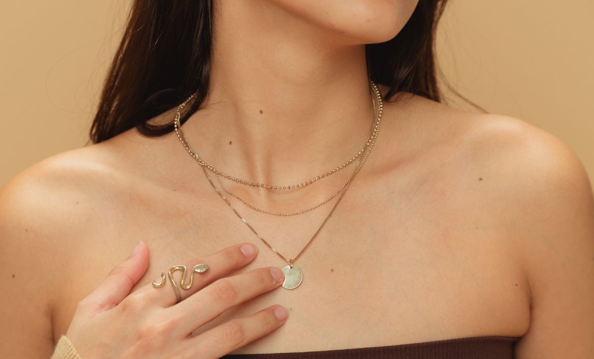 Layered gold necklace made with stainless steel for hypoallergenic jewelry and waterproof daily wear.