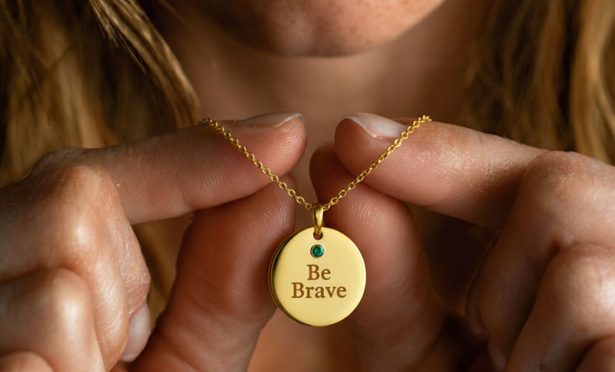 Close up of Be Brave pendant on gold plated brass necklace, dainty non tarnish jewelry with minimalist design